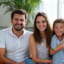 The Rodriguez Family smiling in their newly renovated living room.